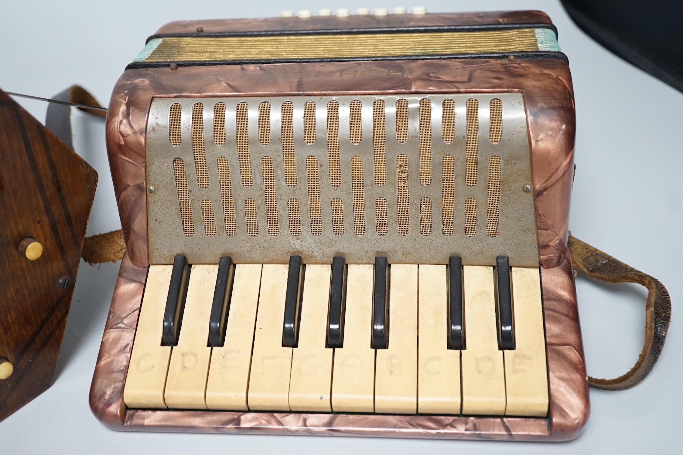 A Hohner Mignon accordion and an Empress concertina